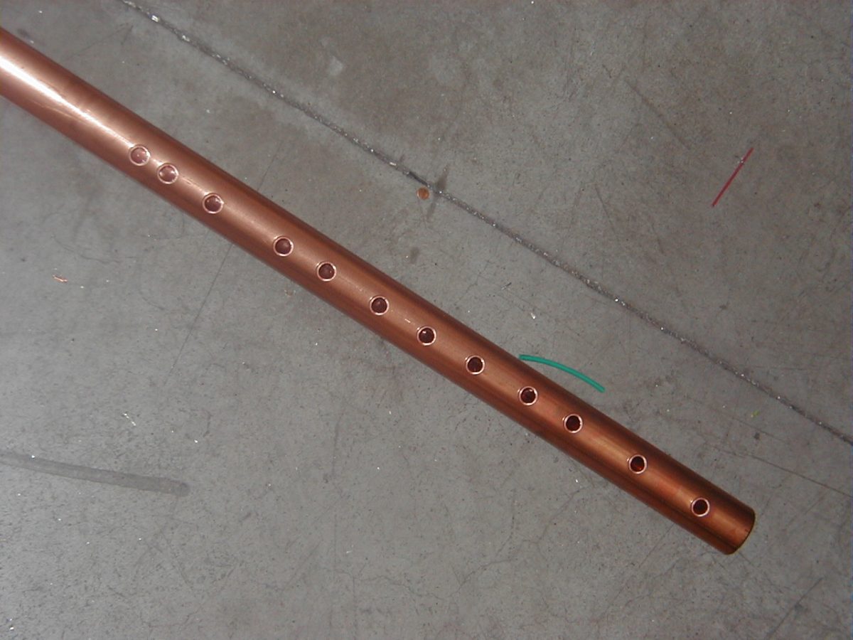 img Manifold with punching on one axis.